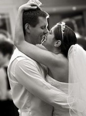Bride and groom dancing their first dance at wedding together
